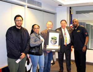 SSC Student artist Destin Harris (left), Art Professor Jack Kirkpatrick and Frank Zuccarelli at the May Board Meeting. 