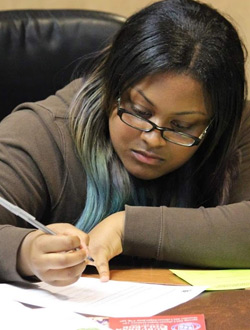 A photo of a girl writing