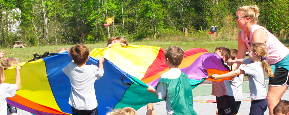 A photo of student PE teacher with students.